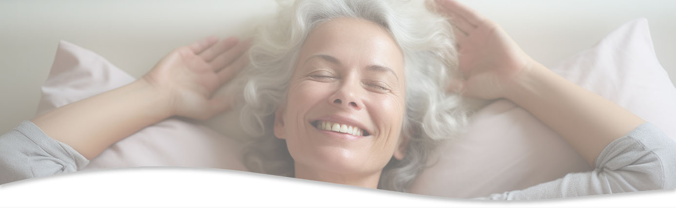 Middle aged woman smiling after acupuncture session for headaches and migraines.